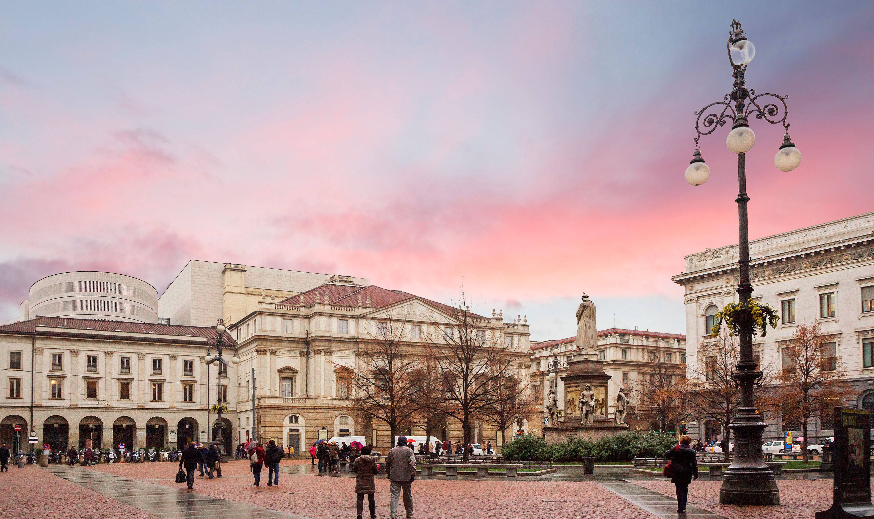 Milan, Italy, La Scala Square. The building of La Scala. La Scala Opera house is located on the picturesque La Scala square, decorated with the monument of Leonardo da Vinci.