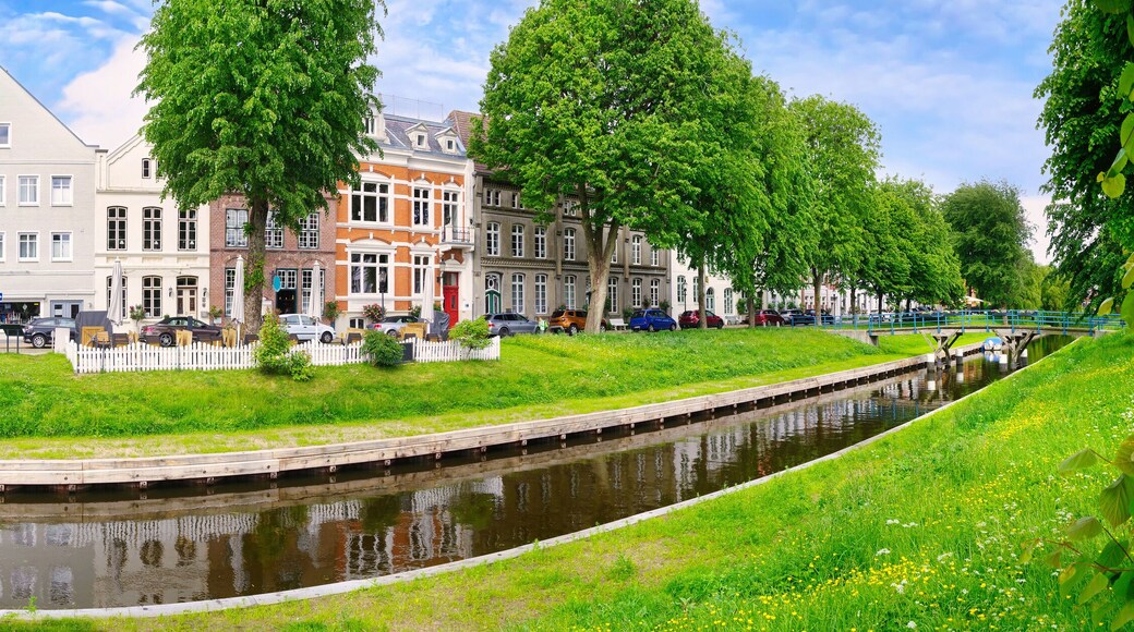 Historic houses and bridge on a sunny day in summer in Friedrichstadt, Germany