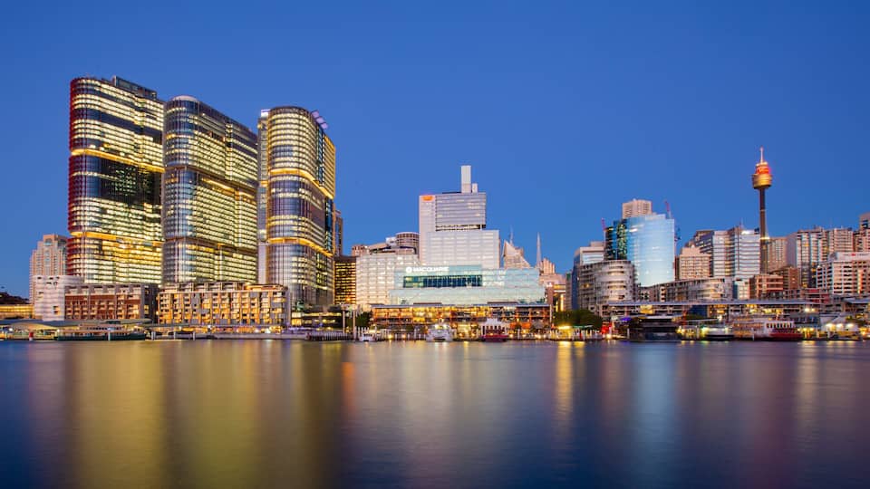 A city skyline with modern buildings and a prominent tower.