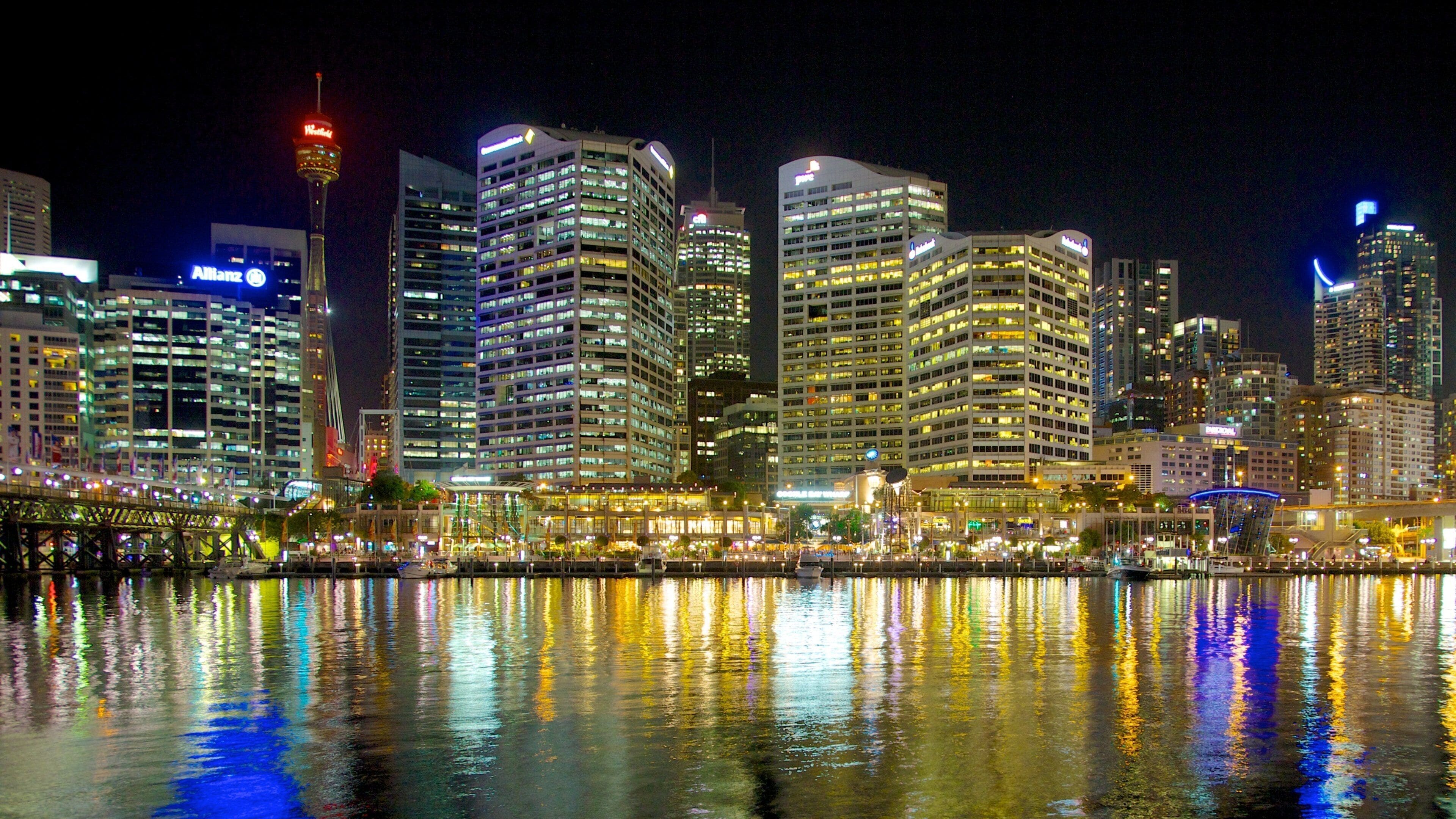 Darling Harbour which includes a city, a bay or harbor and night scenes