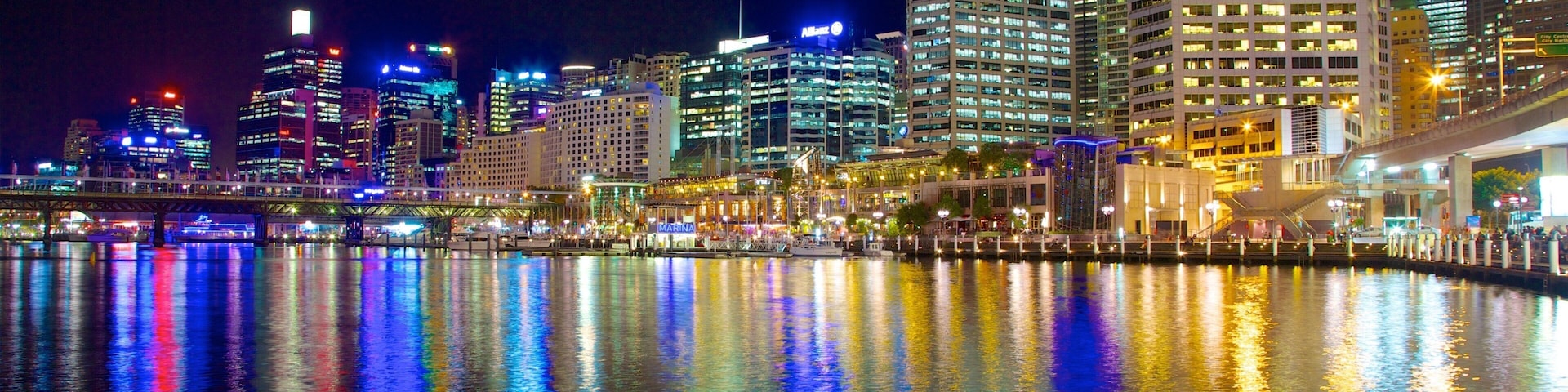 Darling Harbour which includes central business district, night scenes and a bay or harbor