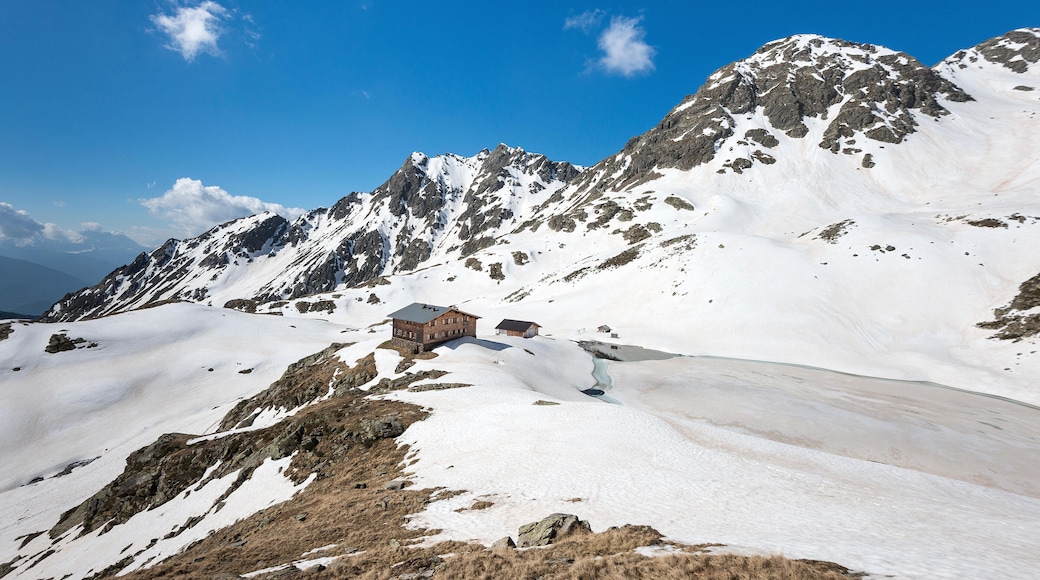 Terento, South Tyrol, Italy. The refuge Lago di Pausa / Tiefrastenhuette and the frozen lake