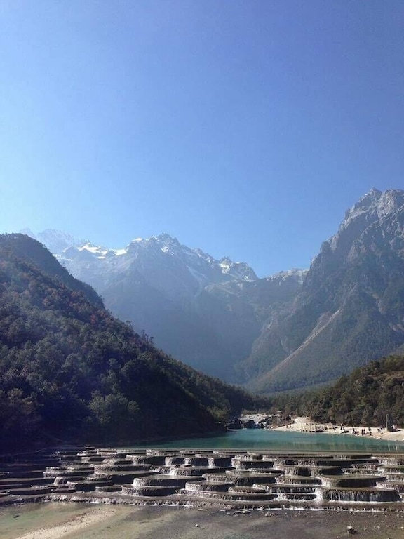Blue Moon Valley actually is an extremely blue river meandering through a lush valley of Jade Dragon Snow Mountain. Seen from a distance, it resembles a blue crescent moon inlaid at the foot of the mountain. That's how the place got its beautiful name. Blue Moon Valley, Lijiang, China #Trovember #BlueMoonValley #Lijiang #China