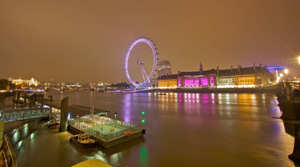 London Eye which includes a river or creek, a city and night scenes