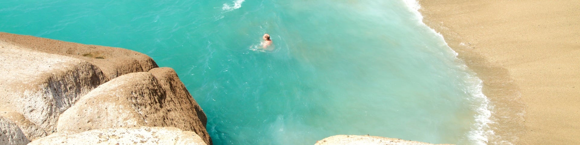 Costa Adeje showing swimming, a sandy beach and general coastal views