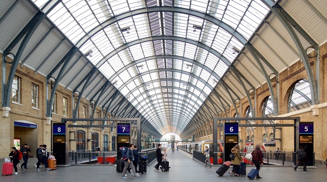 Kings Cross St. Pancras showing interior views and heritage architecture as well as a small group of people