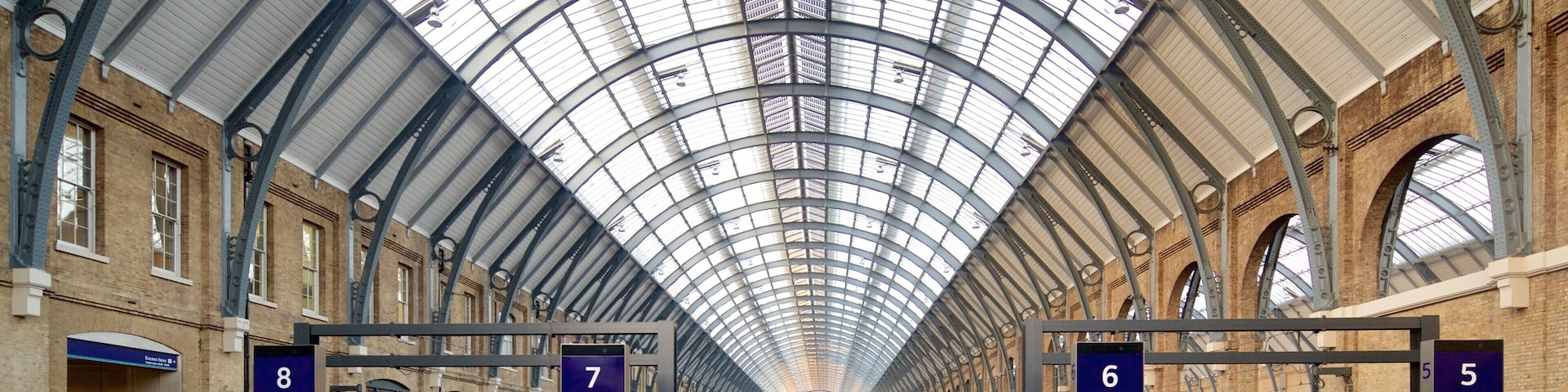 Kings Cross St. Pancras showing interior views and heritage architecture as well as a small group of people