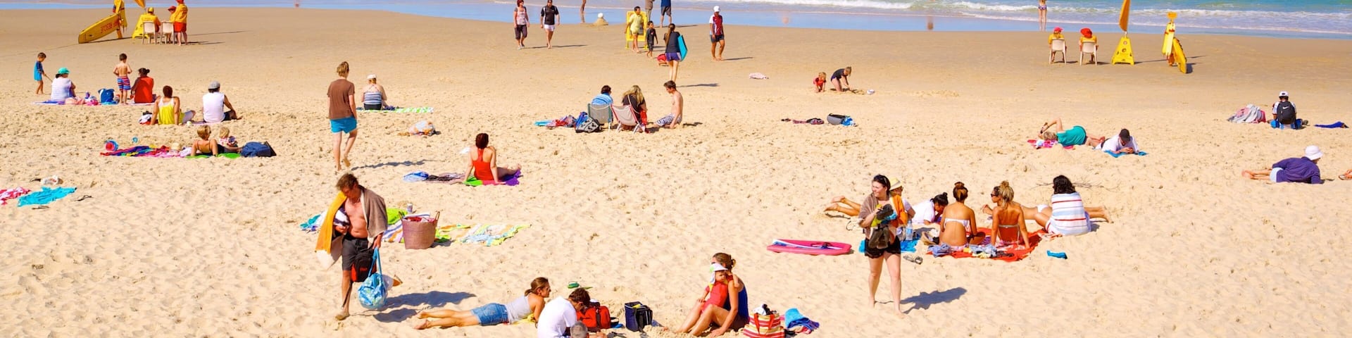 Southport which includes a sandy beach, tropical scenes and swimming