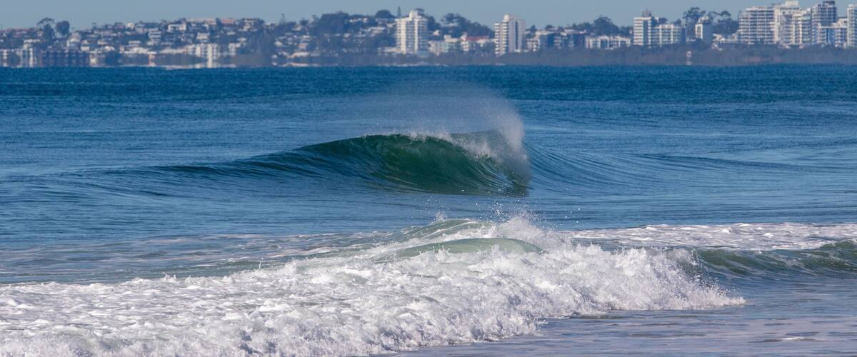 Yaroomba beach on the sunshine coast of Queensland Australia with buildings in the background