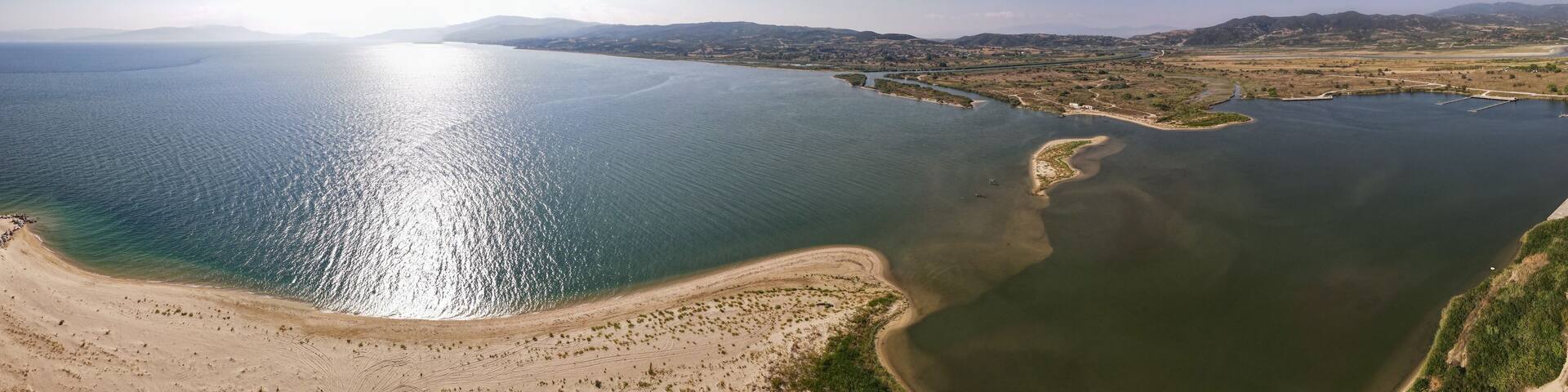 Aerial drone photo over the beach and small peninsula of the Strimonas river in North Greece, Macedonia