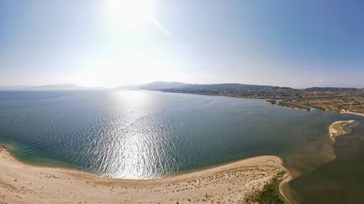 Aerial drone photo over the beach and small peninsula of the Strimonas river in North Greece, Macedonia