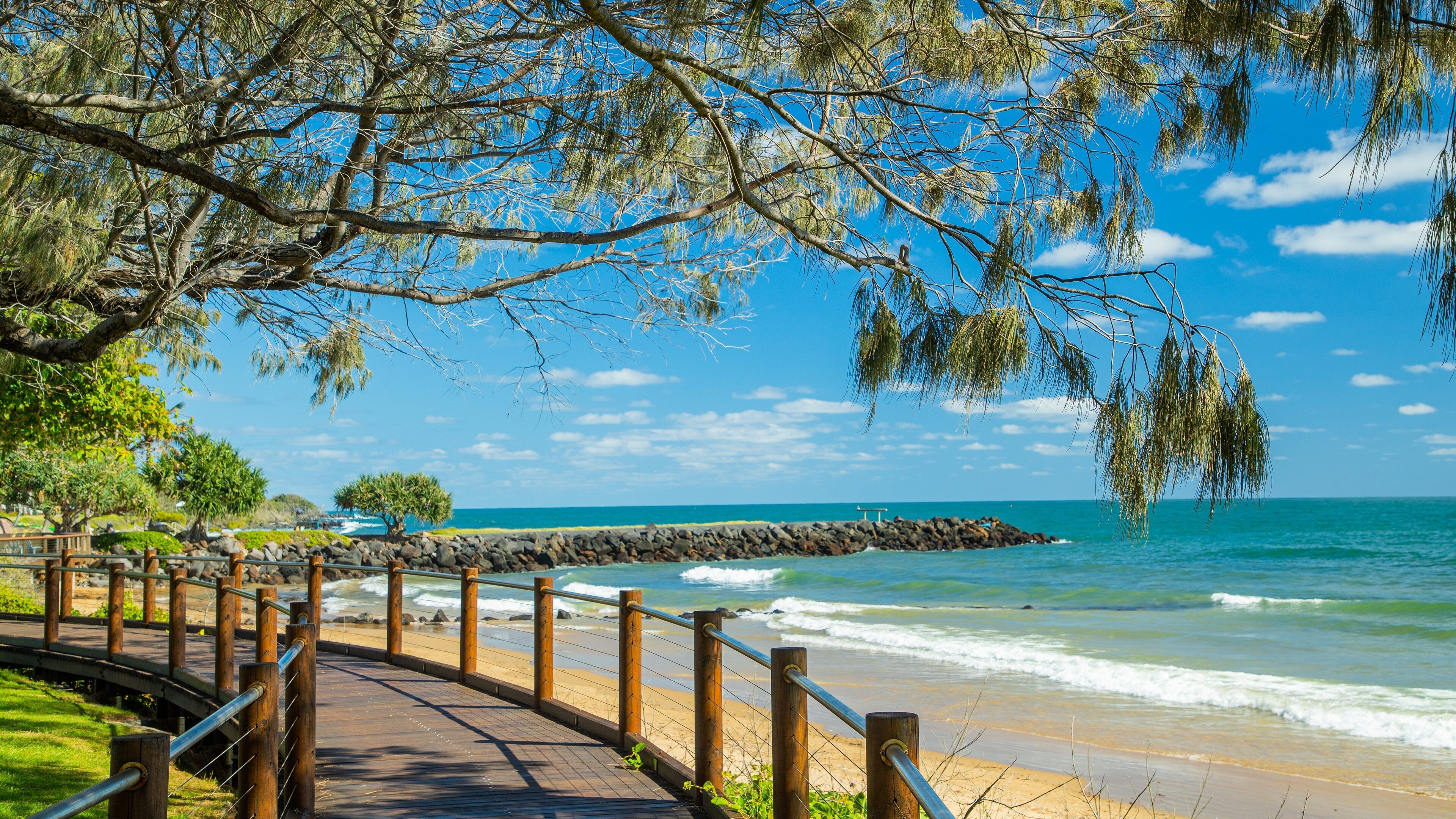 Bargara which includes a beach and general coastal views