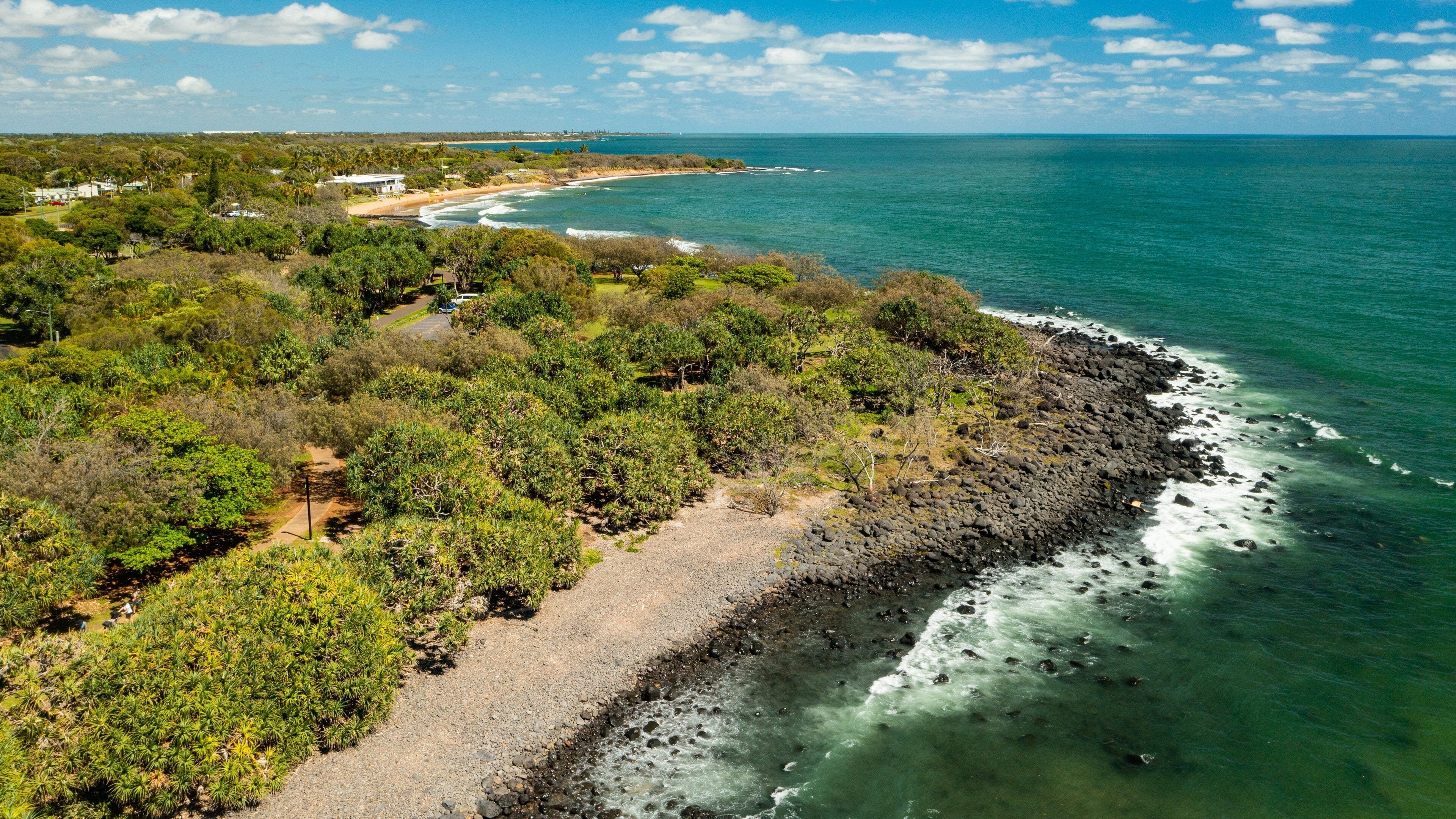 Bargara showing rocky coastline, landscape views and general coastal views