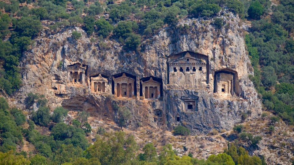 A cliff with ancient rock-cut tombs.
