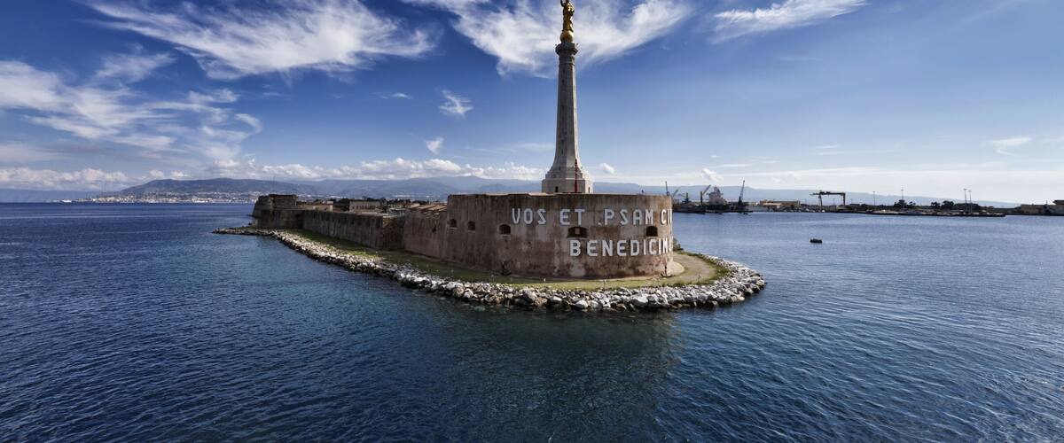 Italy, Sicily, Messina, the Madonna statue at the entrance of the port, Calabria coastline in the background; Shutterstock ID 63322723