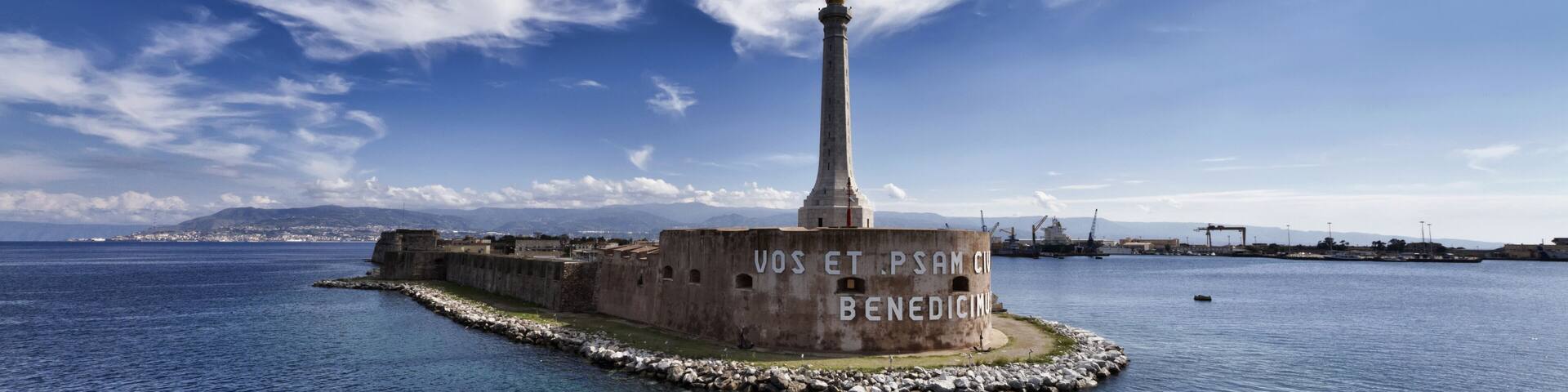 Italy, Sicily, Messina, the Madonna statue at the entrance of the port, Calabria coastline in the background; Shutterstock ID 63322723