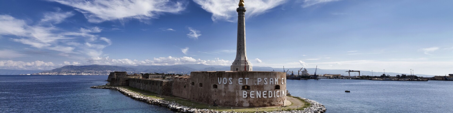 Italy, Sicily, Messina, the Madonna statue at the entrance of the port, Calabria coastline in the background; Shutterstock ID 63322723