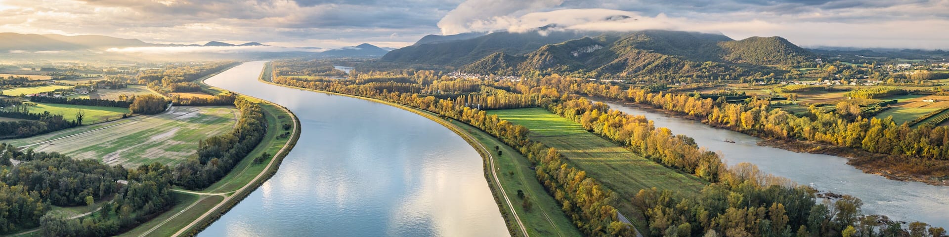 Sunrise Landscape over Rhone River in France with Mountains, Fields and Scenic Nature, Aerial View of Serene Countryside at Dawn