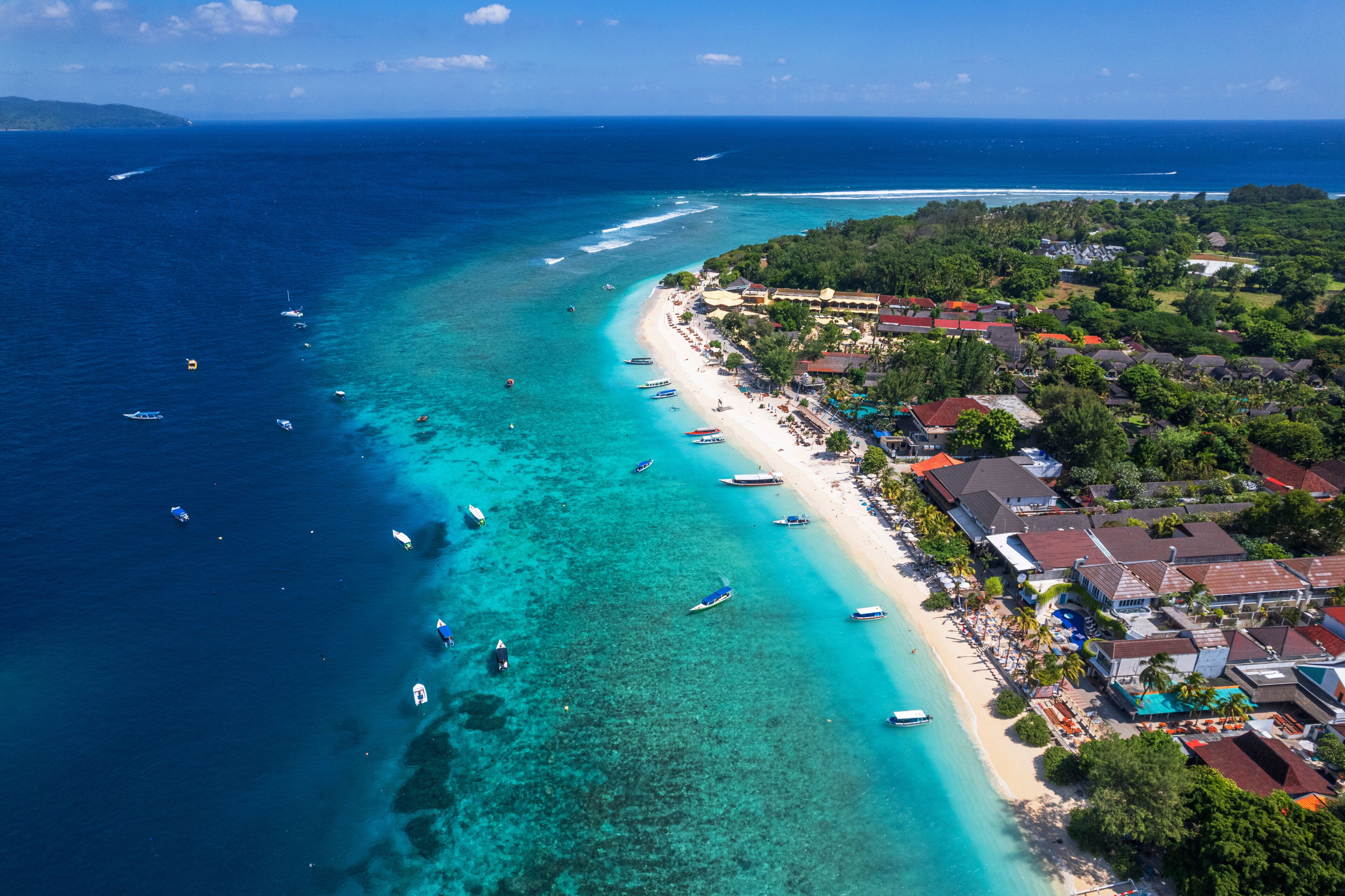 Aerial view of Gili Trawangan beach with boats anchored in the ocean, Gili Trawangan, Gili Islands archipelago, Lombok, West Nusa Tenggara, Indonesia, Southeast Asia