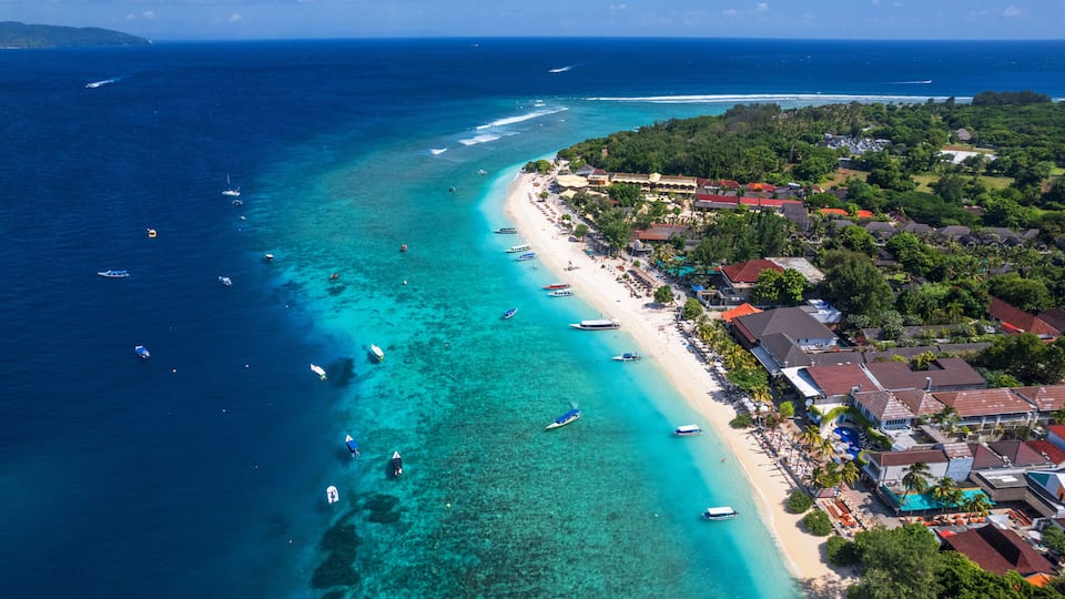 Aerial view of Gili Trawangan beach with boats anchored in the ocean, Gili Trawangan, Gili Islands archipelago, Lombok, West Nusa Tenggara, Indonesia, Southeast Asia