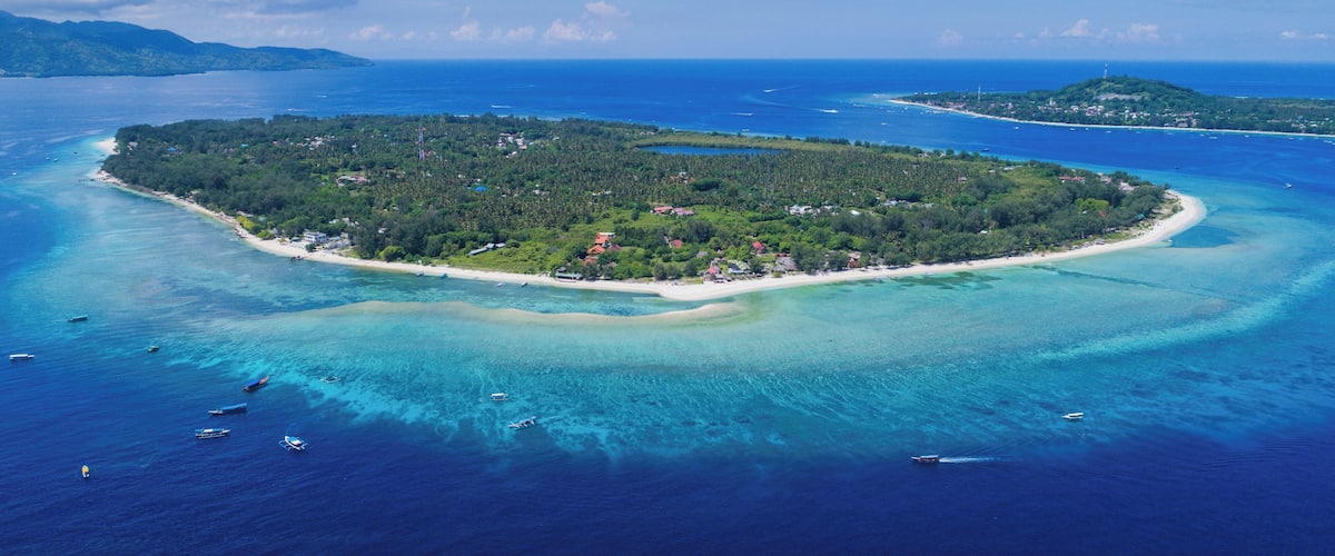 aerial view of Gili Trawangan island with clear blue sky in Lombok, Indonesia