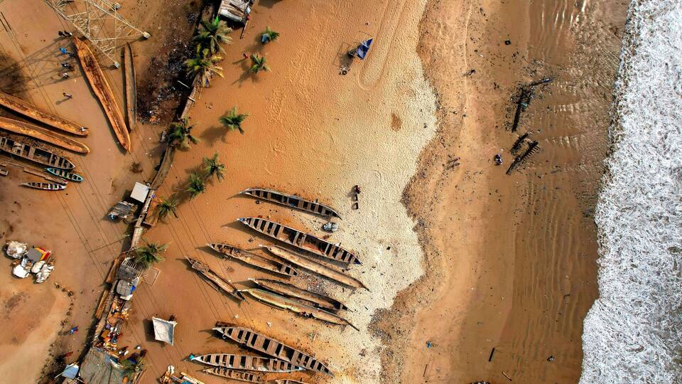 Aerial view of wooden boats at the beach of Tema in Ghana