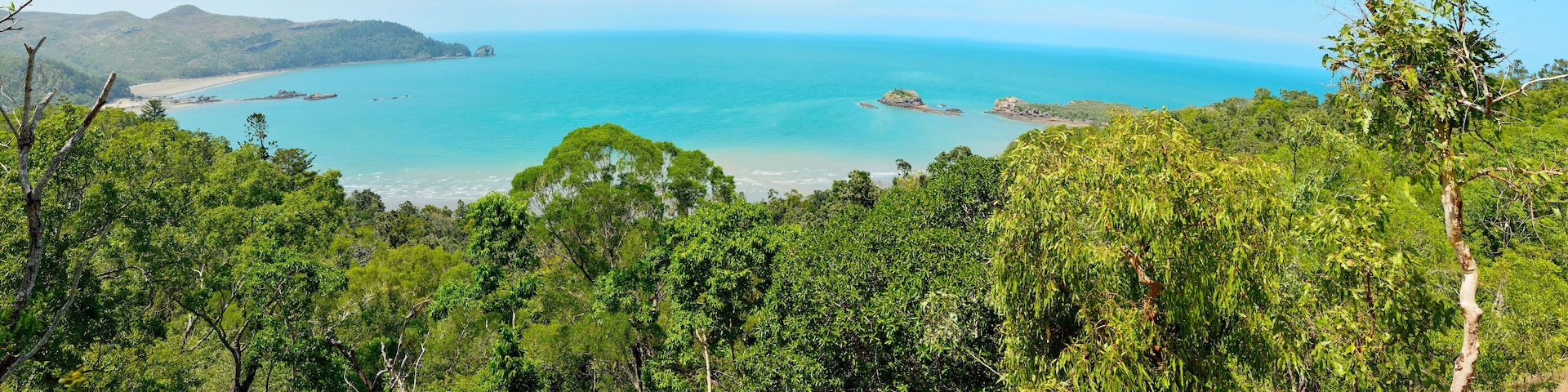 Panoramic view of Cape Hillsborough with Wedge Island and reef in Cape Hillsborough National Park in Australia.
