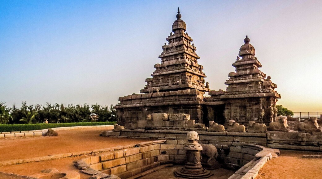 The Shore Temple at Mahabalipuram, India. It was built with blocks of granite, dating from the 8th century AD. At the time of its creation, the village was a busy port during the reign of Narasimhavarman II of the Pallava dynasty. As one of the Group of Monuments at Mahabalipuram, it has been classified as a UNESCO World Heritage Site since 1984 and it is one of the oldest structural stone temples of South India.