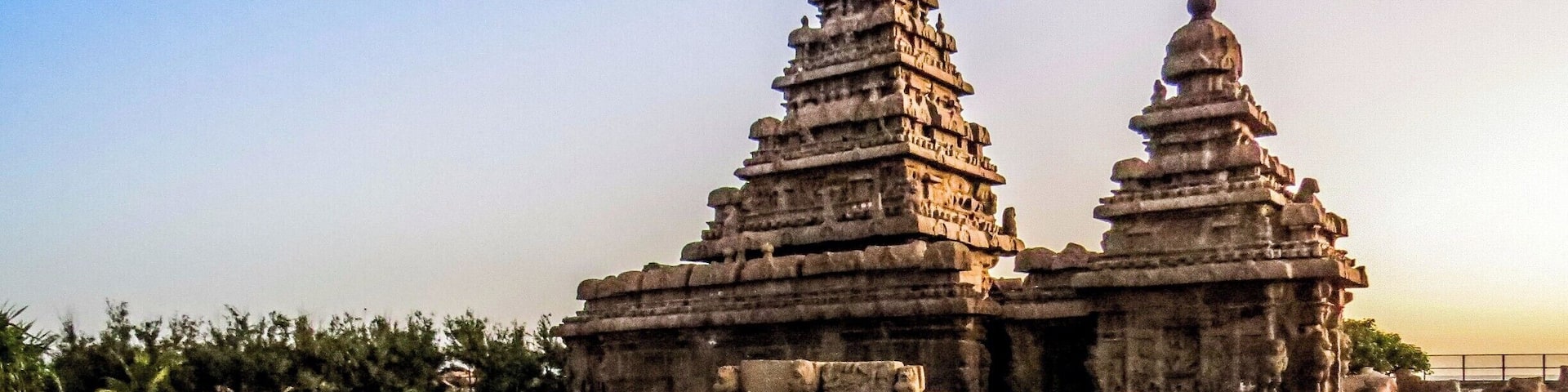 The Shore Temple at Mahabalipuram, India. It was built with blocks of granite, dating from the 8th century AD. At the time of its creation, the village was a busy port during the reign of Narasimhavarman II of the Pallava dynasty. As one of the Group of Monuments at Mahabalipuram, it has been classified as a UNESCO World Heritage Site since 1984 and it is one of the oldest structural stone temples of South India.
