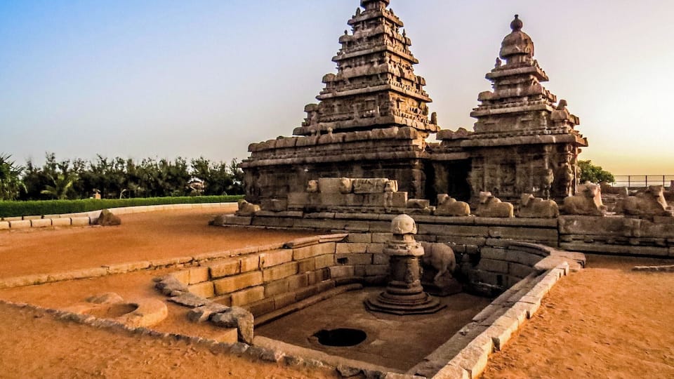 The Shore Temple at Mahabalipuram, India. It was built with blocks of granite, dating from the 8th century AD. At the time of its creation, the village was a busy port during the reign of Narasimhavarman II of the Pallava dynasty. As one of the Group of Monuments at Mahabalipuram, it has been classified as a UNESCO World Heritage Site since 1984 and it is one of the oldest structural stone temples of South India.