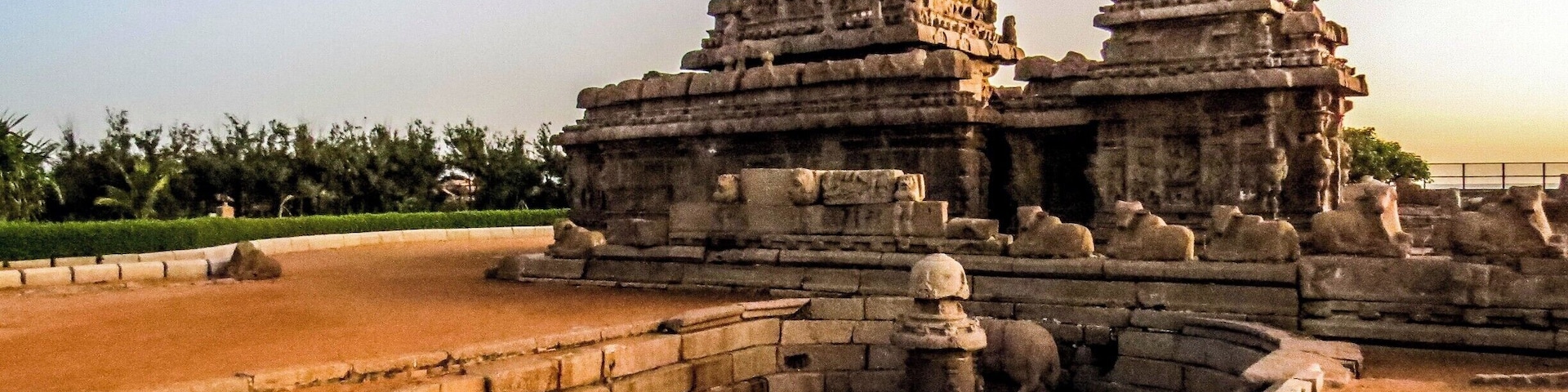 The Shore Temple at Mahabalipuram, India. It was built with blocks of granite, dating from the 8th century AD. At the time of its creation, the village was a busy port during the reign of Narasimhavarman II of the Pallava dynasty. As one of the Group of Monuments at Mahabalipuram, it has been classified as a UNESCO World Heritage Site since 1984 and it is one of the oldest structural stone temples of South India.