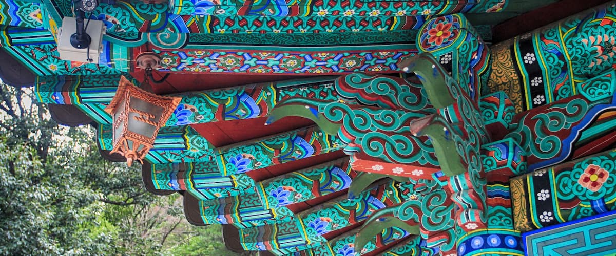 A colorful, intricately patterned roof with traditional designs.