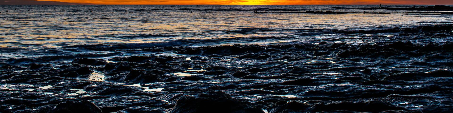 Sunset with a gradient of orange on the ocean, Sauzaie beach in Brétignolles-sur-Mer, Vendée, FRANCE.