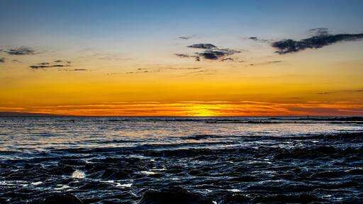 Sunset with a gradient of orange on the ocean, Sauzaie beach in Brétignolles-sur-Mer, Vendée, FRANCE.
