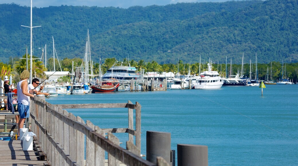 Tropical North Queensland showing a bay or harbour and fishing as well as an individual male