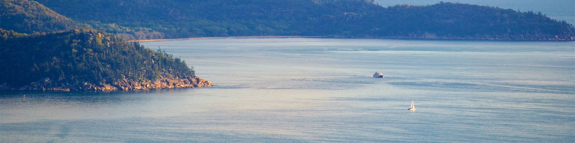 Magnetic Island showing a bay or harbor, general coastal views and a sunset