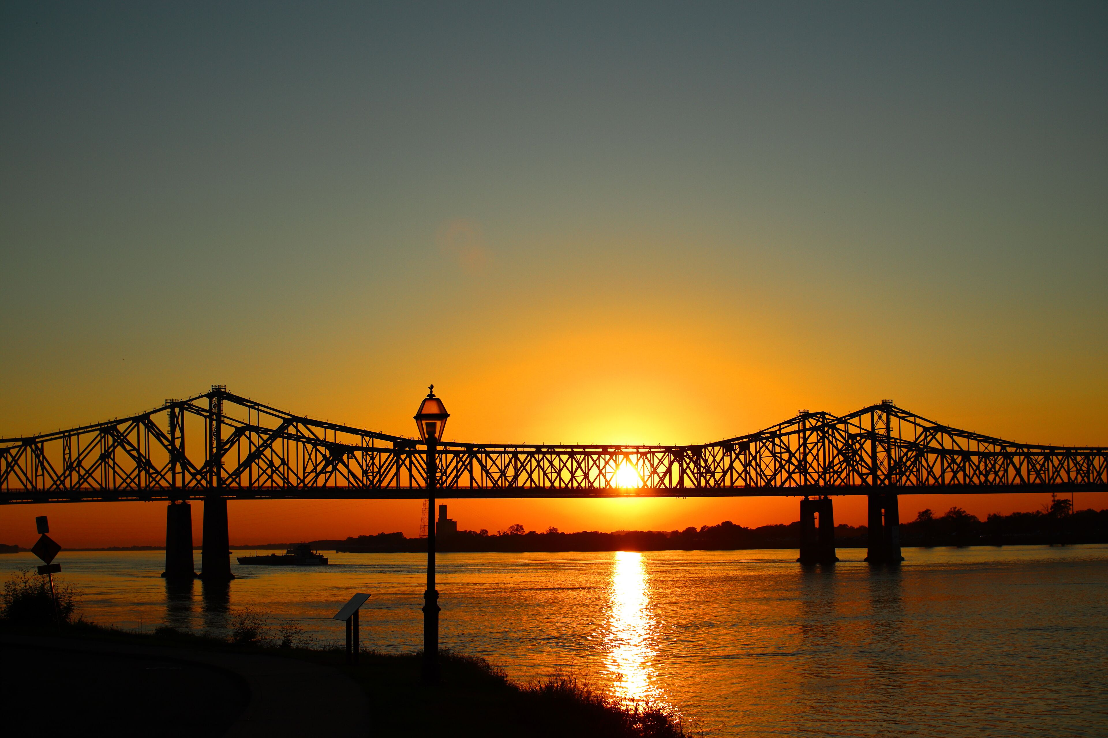 Scenic view of the Natchez–Vidalia Bridge in Louisiana on a sunset sky background
