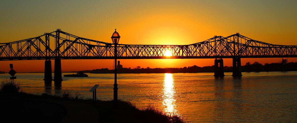 Scenic view of the Natchez–Vidalia Bridge in Louisiana on a sunset sky background