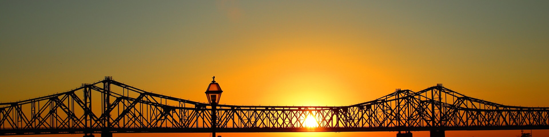 Scenic view of the Natchez–Vidalia Bridge in Louisiana on a sunset sky background