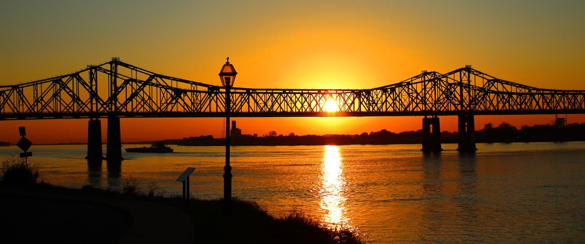 Scenic view of the Natchez–Vidalia Bridge in Louisiana on a sunset sky background