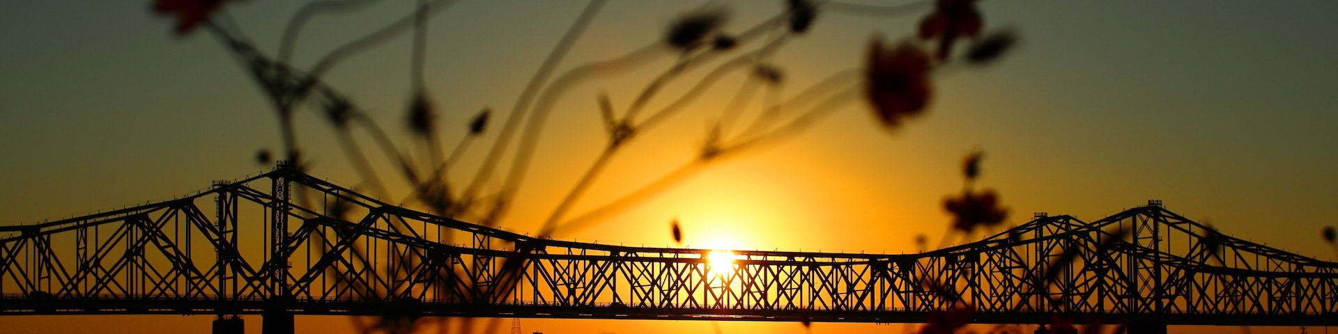 Scenic view of the Natchez–Vidalia Bridge in Louisiana on a sunset sky background