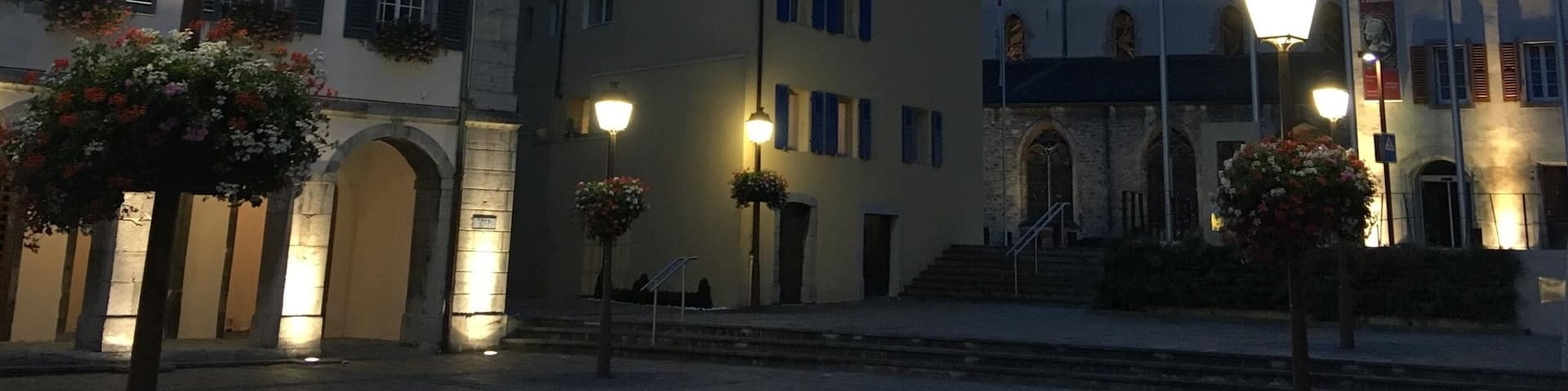 The old town of Saint Maurice with its monastery under the mountains.