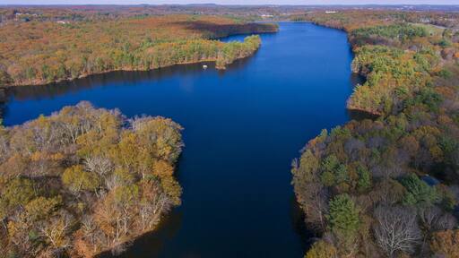 Ashland Reservoir aerial view with fall foliage in Ashland State Park in town of Ashland, Massachusetts MA, USA.