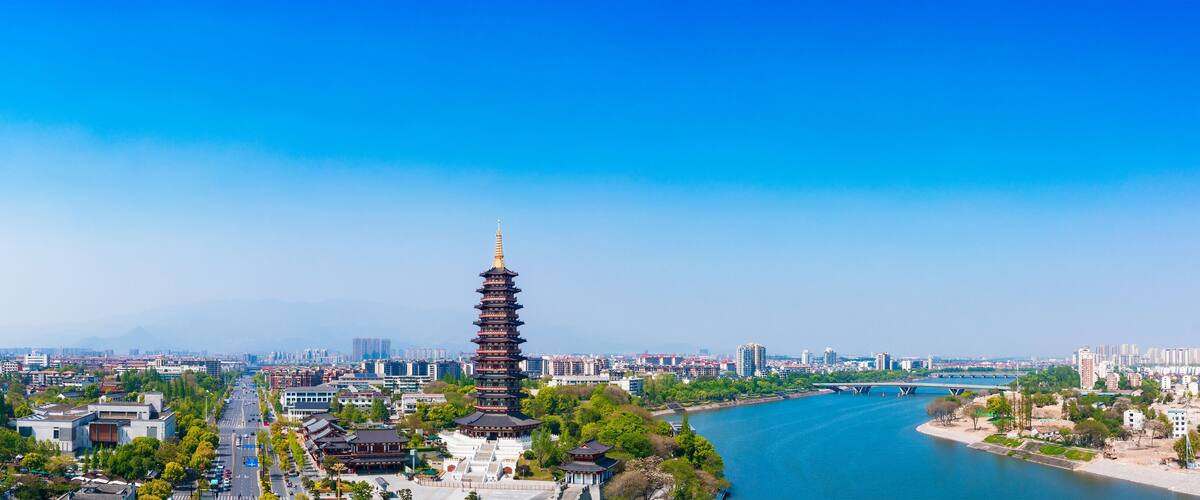 A pagoda, a river, and a cityscape.