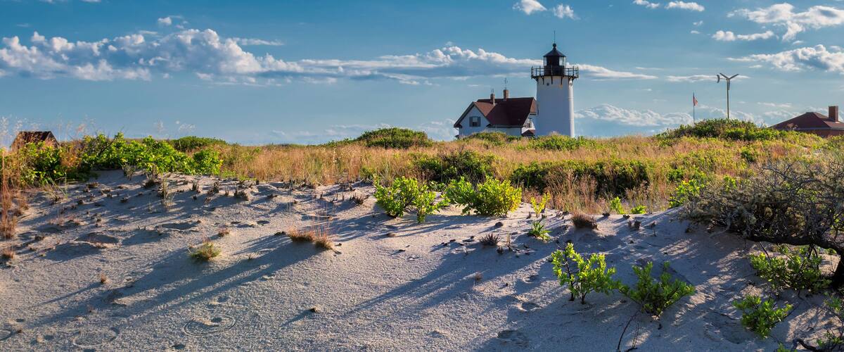 Lighthouse Point on beach dunes, Race Point Light Lighthouse in Cape Code, New England, Massachusetts, USA.