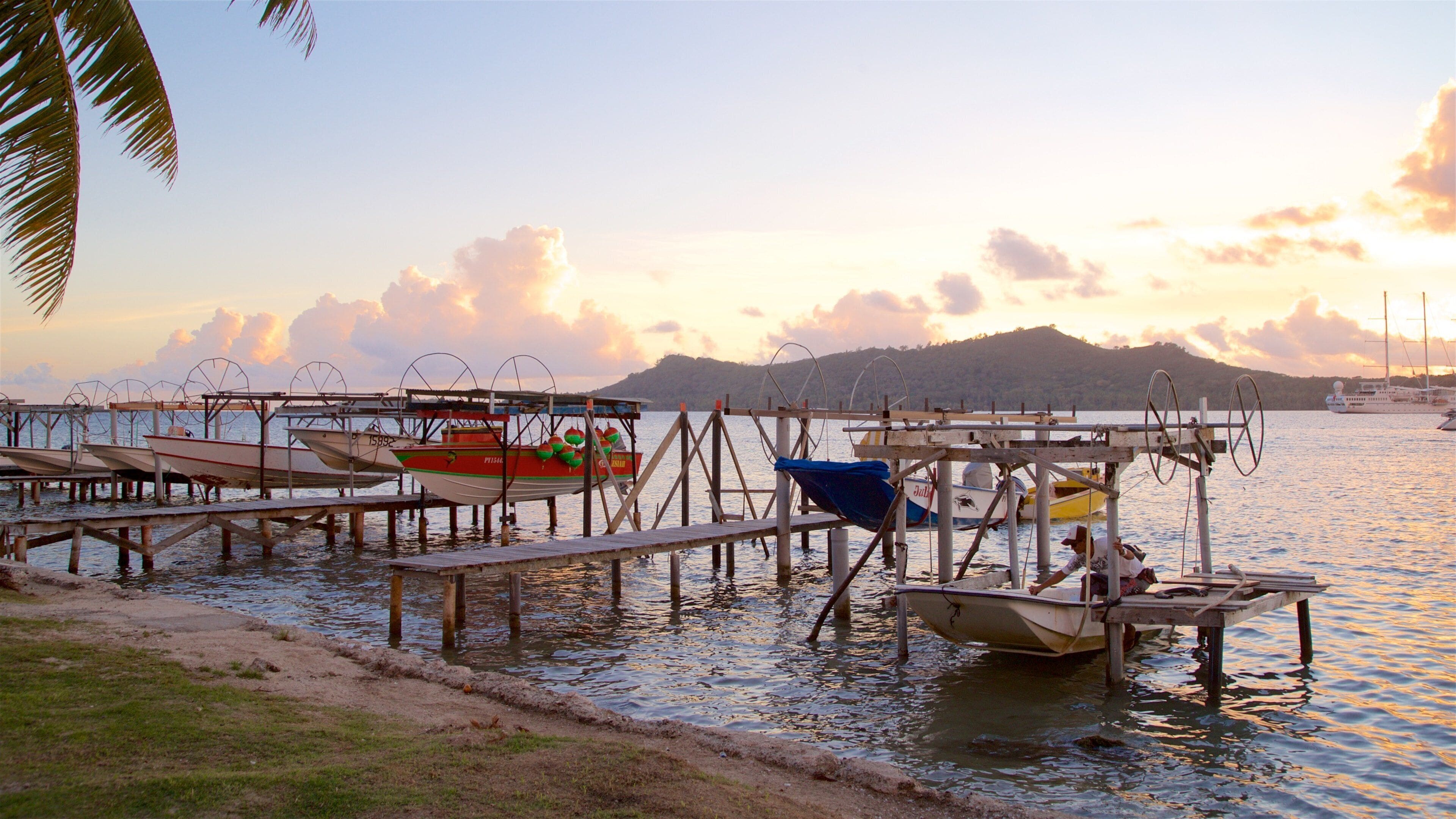 Vaitape featuring a bay or harbor and a sunset