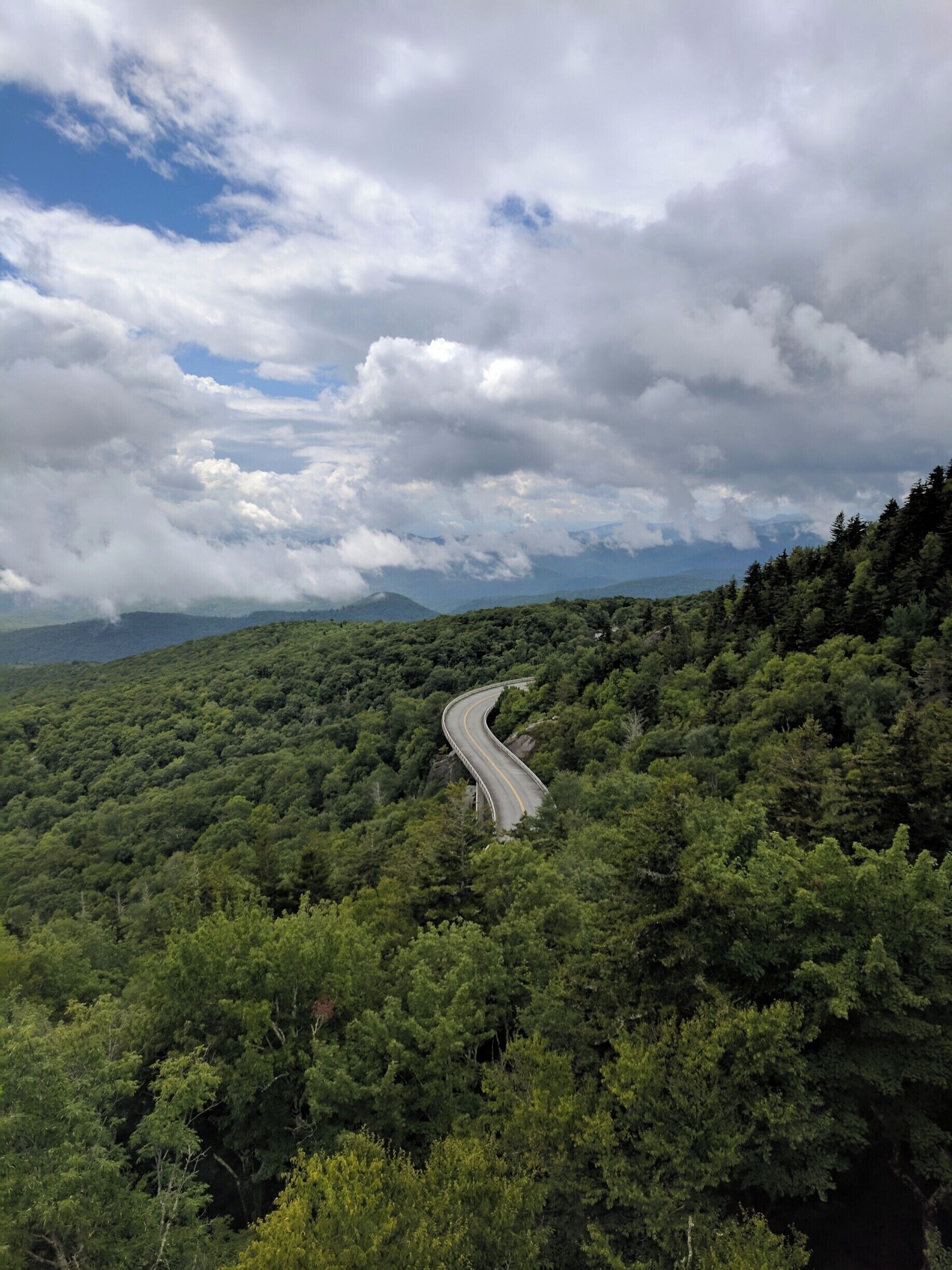 A sight of civilization amidst the vast Blue Ridge Mountains. Of the themes that I've attributed to the Appalachian region is civilization within nature. In Appalachia these things go hand in hand. A place that is hard to live in terms of weather and landscape, still never fails to attract people to live here. I took this picture on an un-official hiking trail that leads to an overlook of the Linn Cove Viaduct. The hike was extremely strenuous as there was no official trail to follow and it was mostly vertical all the way up. My roommate and I also heard some strange animal noises going up and I was stung by a yellow jacket, but it was all worth it for this picture. #appalachianechoes