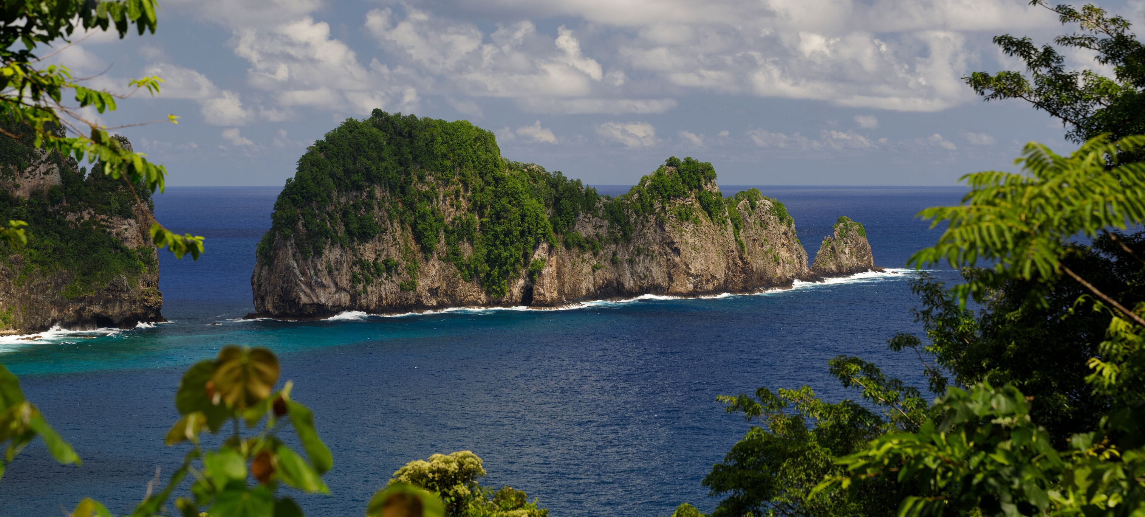 Natural rock formations of the Vai'ava Strait National Natural Landmark stretches out into the Pacific Ocean and is part of the National Park of American Samoa.