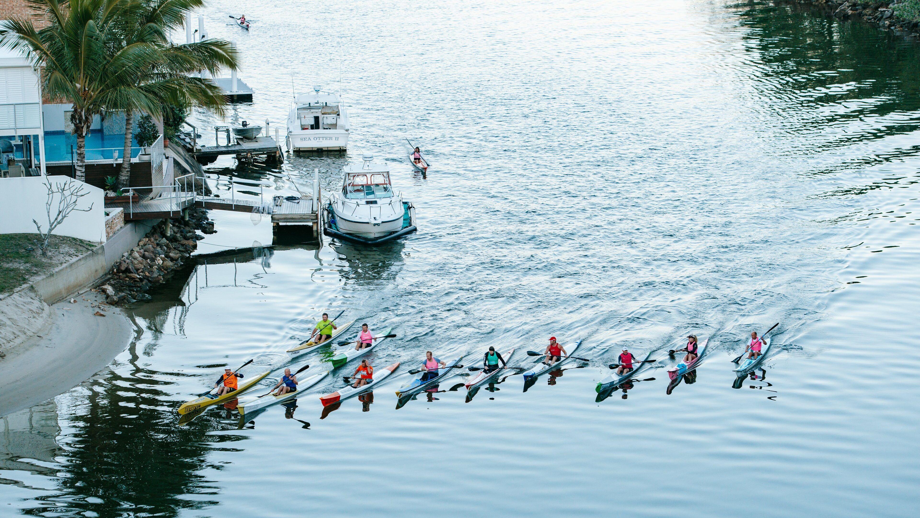 Noosaville featuring kayaking or canoeing and general coastal views as well as a small group of people