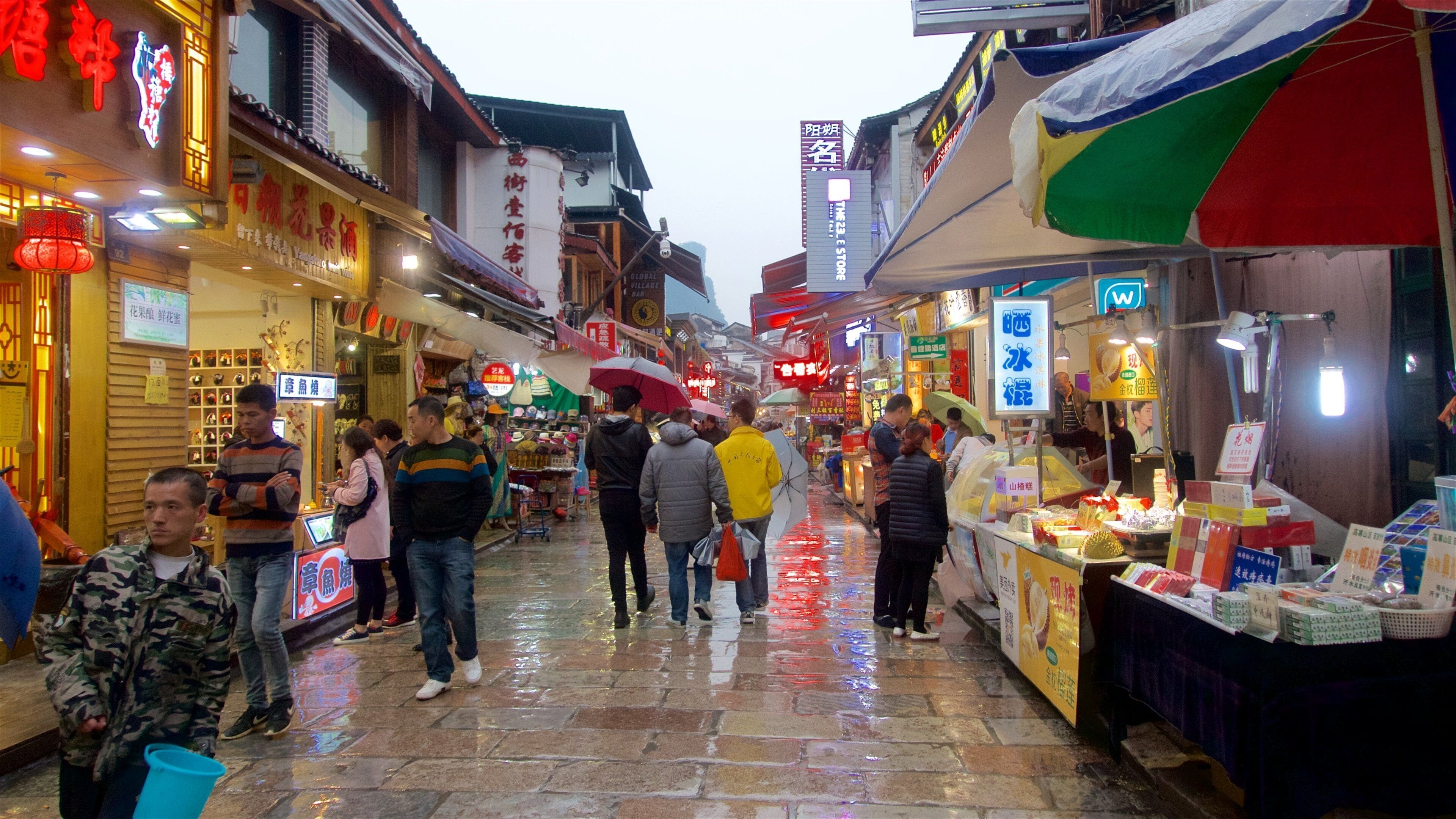 Yangshuo showing markets as well as a small group of people